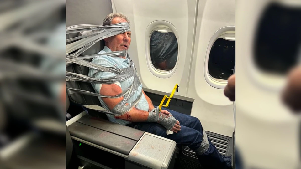 Source-supplied image for: Passenger duct-taped, zip-tied to seat after midair outburst on American Airlines